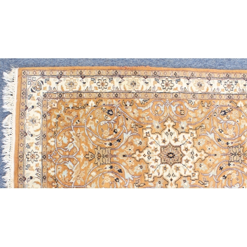 594 - A Kashmir rug; light terracotta ground with ivory central medallion and main ivory border (156 x 93 ... 