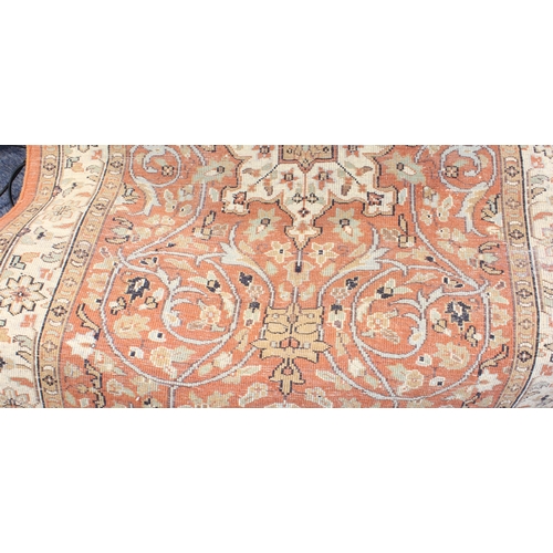 594 - A Kashmir rug; light terracotta ground with ivory central medallion and main ivory border (156 x 93 ... 