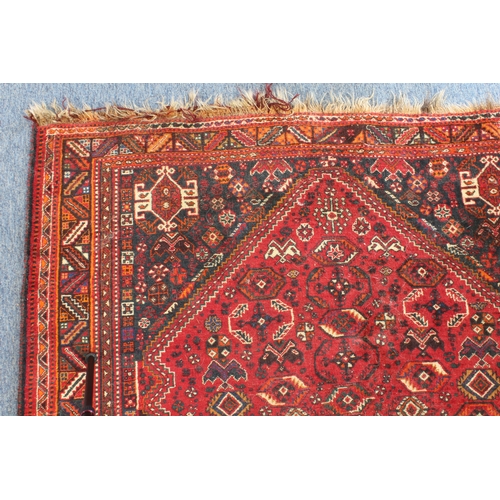 596 - A south-west Persian Shiraz rug: probably 20th century, the central eight sided medallion on a six-s... 