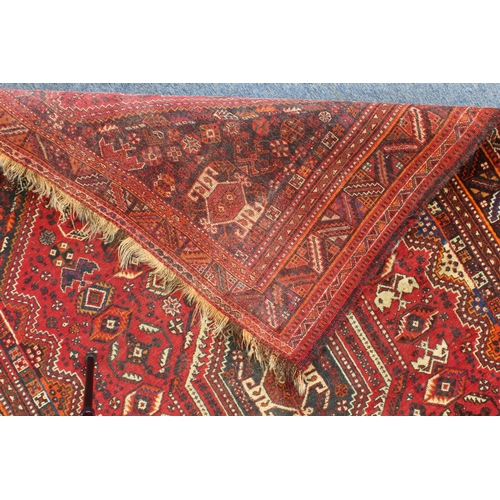 596 - A south-west Persian Shiraz rug: probably 20th century, the central eight sided medallion on a six-s... 