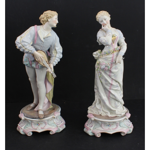 17 - A large pair of 19th century hand-decorated German porcelain figures: male and female in early-style... 