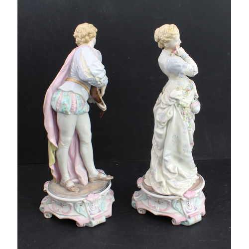 17 - A large pair of 19th century hand-decorated German porcelain figures: male and female in early-style... 