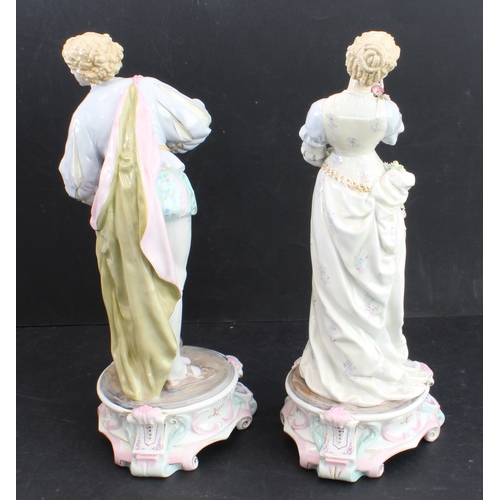 17 - A large pair of 19th century hand-decorated German porcelain figures: male and female in early-style... 