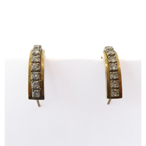 209 - A pair of 14ct two-colour gold and diamond half hoop earrings - each set with a row of nine brillian... 