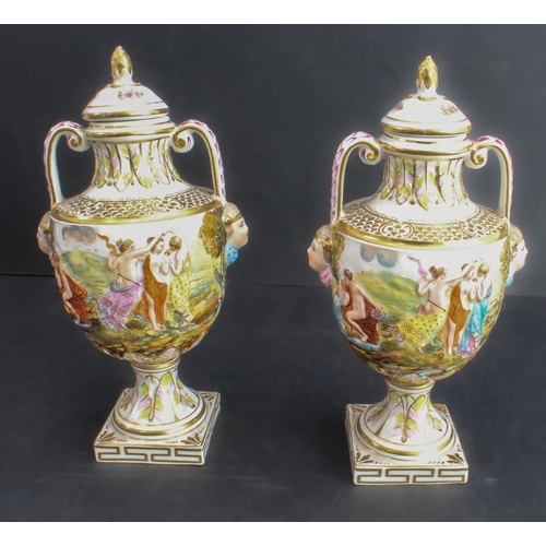 22 - A pair of late 19th century Capo di Monte porcelain urns and covers: hand-gilded and the handles wit... 