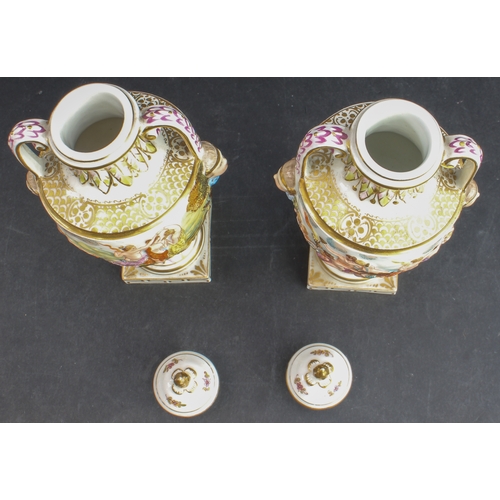 22 - A pair of late 19th century Capo di Monte porcelain urns and covers: hand-gilded and the handles wit... 