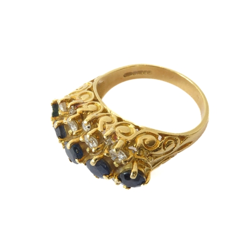 242 - An 18ct yellow gold, sapphire and diamond three row ring - hallmarked Birm. 1992, with a central row... 