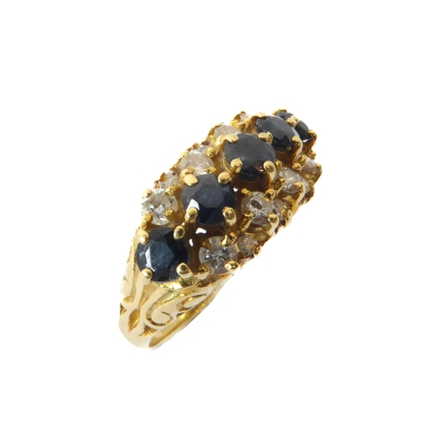 242 - An 18ct yellow gold, sapphire and diamond three row ring - hallmarked Birm. 1992, with a central row... 