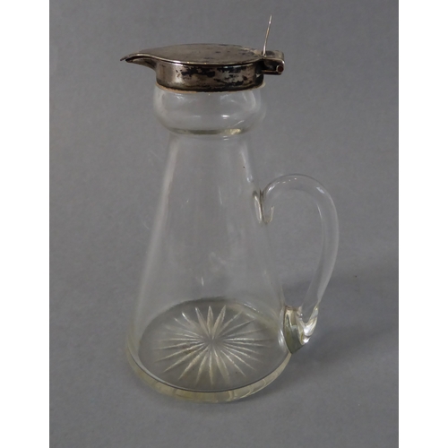 31 - An early 20th century silver-mounted whiskey tot: conical form, hinged top with thumbpiece, assayed ... 