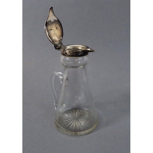 31 - An early 20th century silver-mounted whiskey tot: conical form, hinged top with thumbpiece, assayed ... 