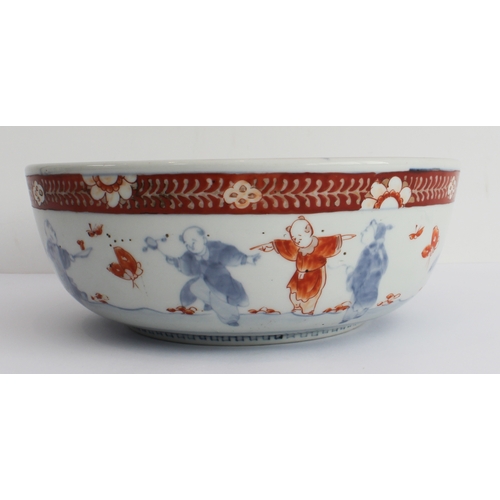 49 - A 19th century Japanese porcelain bowl: the interior decorated with four cranes in flight above four... 