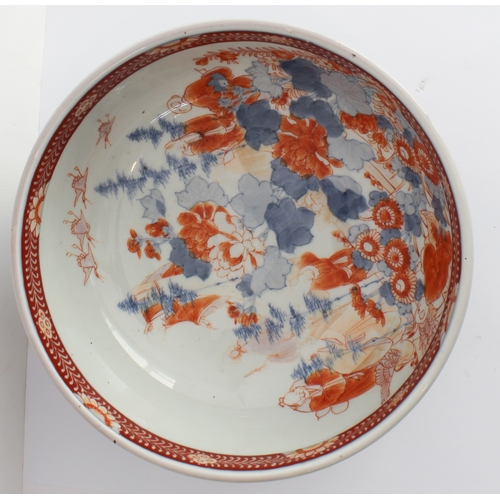 49 - A 19th century Japanese porcelain bowl: the interior decorated with four cranes in flight above four... 