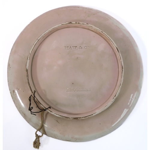 14 - A late 19th century Maw & Co. Art Pottery charger: centrally decorated with an open-winged dove over... 