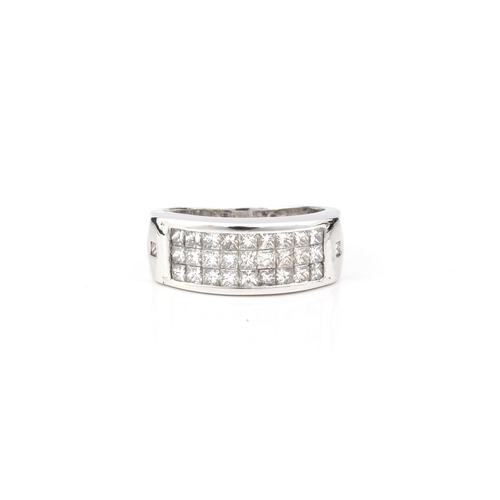 239 - An 18ct white gold and diamond three row ring - unmarked, tests as 18ct, channel set with three rows... 