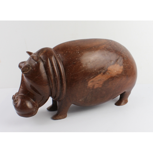 123 - A well carved and modelled African hardwood carving of a hippopotamus: probably early to mid 20th ce... 