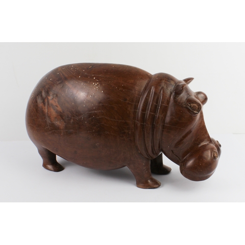 123 - A well carved and modelled African hardwood carving of a hippopotamus: probably early to mid 20th ce... 