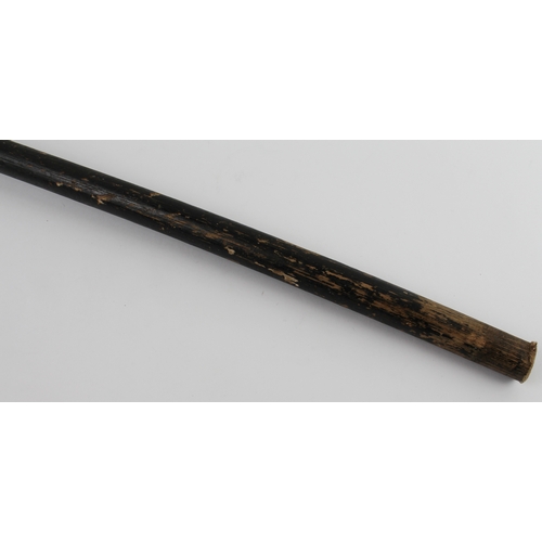 126 - An ebonised walking cane (probably early 20th century): the curved handle with a white metal mounted... 