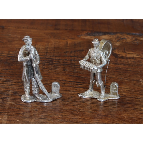 148 - An unusual pair of hallmarked silver figural menu holders/place settings modelled as a Quaker style ... 