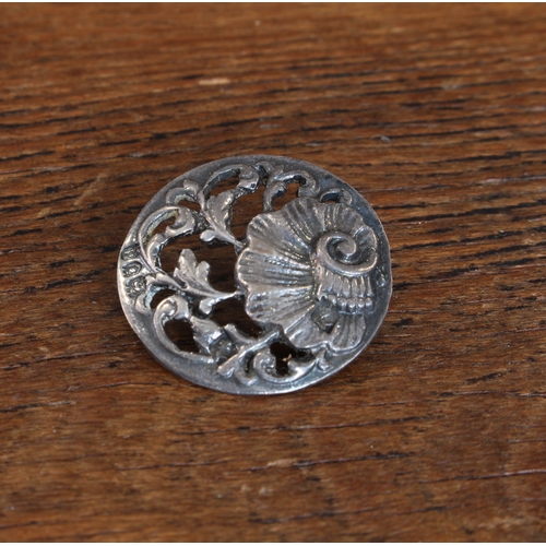 171 - A set of six early 20th century hallmarked silver buttons: each with pierced scrolling foliate decor... 