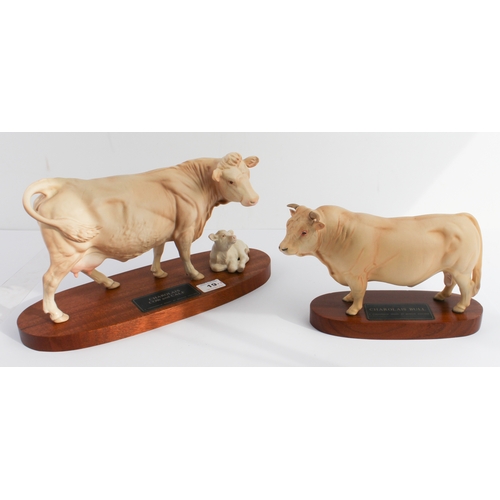 19 - A Beswick 'Connoisseur' model, 'Charolais Cow and Calf' upon an oval stained mahogany base and a sim... 