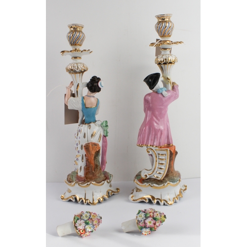 21 - A pair of 19th century hand gilded and decorated continental porcelain candlesticks of figural form:... 