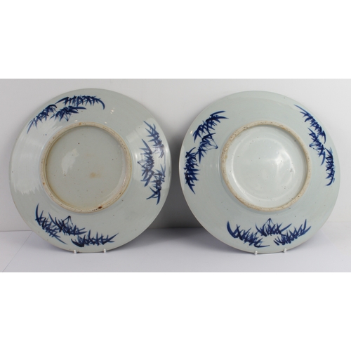 37 - A pair of Chinese blue-and-white porcelain chargers: probably late 19th century, painted with two op... 