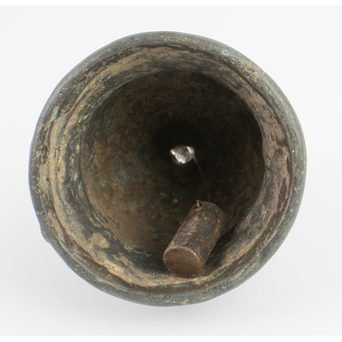 63 - A Burmese bronze temple bell: probably mid-19th century, the flared body cast with two reeded bands,... 