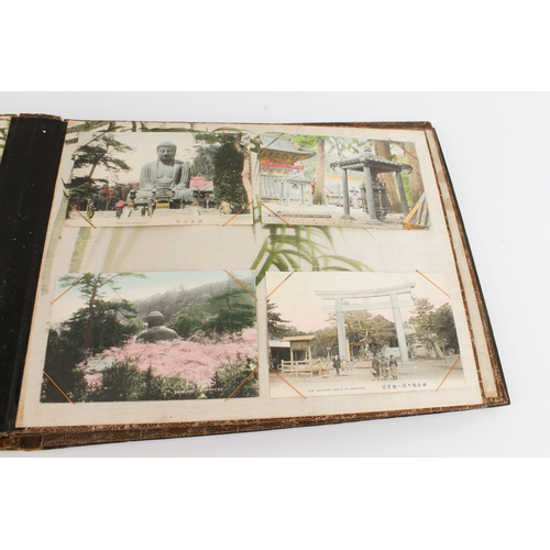 68 - A Japanese lacquer postcard album - 1920s-30s, the black lacquer cover decorated with a handpainted ... 