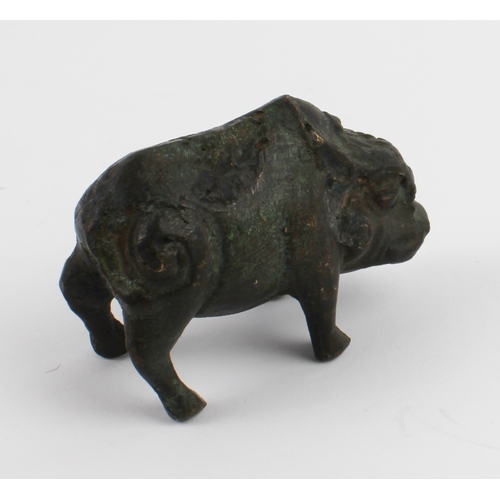 71 - A patinated Chinese bronze model of a wild boar standing four square and with his curled tail angled... 