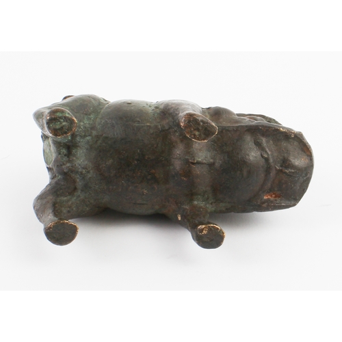 71 - A patinated Chinese bronze model of a wild boar standing four square and with his curled tail angled... 