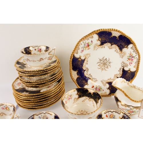 18 - An early 20th century Coalport porcelain tea service. Each piece hand-gilded and decorated with flor... 