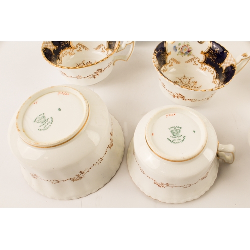 18 - An early 20th century Coalport porcelain tea service. Each piece hand-gilded and decorated with flor... 