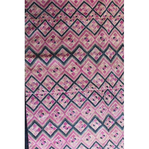 61 - A Burmese embroidered wall hanging - probably Yao tribe, typically worked with geometric bands of di... 