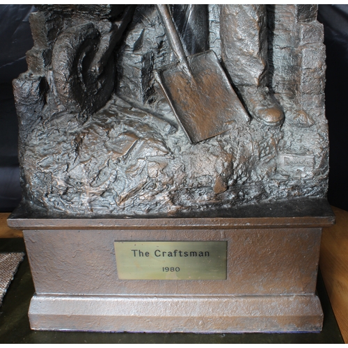 135 - A large and imposing bronzed fibreglass-resin sculpture 'The Craftsman 1980': the male figure stands... 