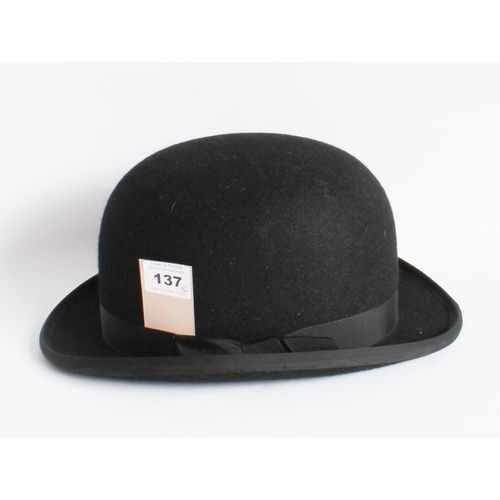 137 - Lock & Co. (Hatters, St James St., London): a black bowler hat within original box, together with a ... 