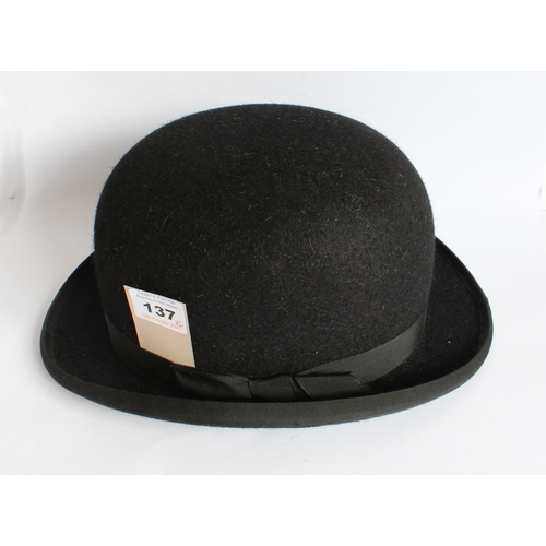 137 - Lock & Co. (Hatters, St James St., London): a black bowler hat within original box, together with a ... 