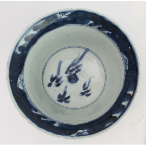 57 - An 18th century Chinese porcelain bowl with slightly everted rim, the interior with stylised flaming... 