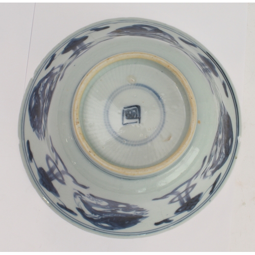 57 - An 18th century Chinese porcelain bowl with slightly everted rim, the interior with stylised flaming... 