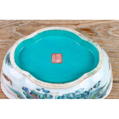 34 - A 20th century Chinese porcelain bowl of quatrefoil form: matt duck-egg blue glazed interior; the ex... 