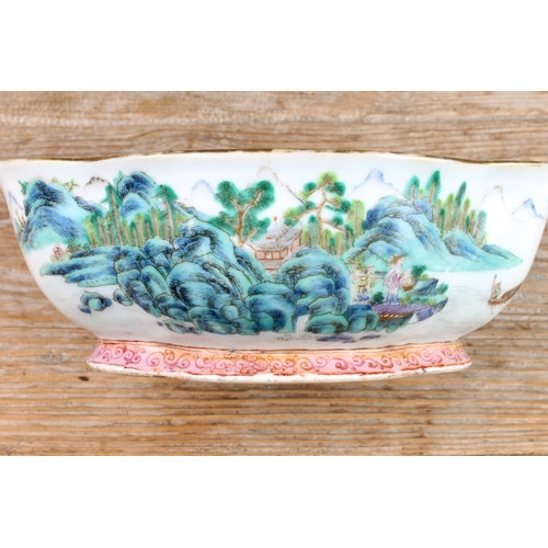 34 - A 20th century Chinese porcelain bowl of quatrefoil form: matt duck-egg blue glazed interior; the ex... 