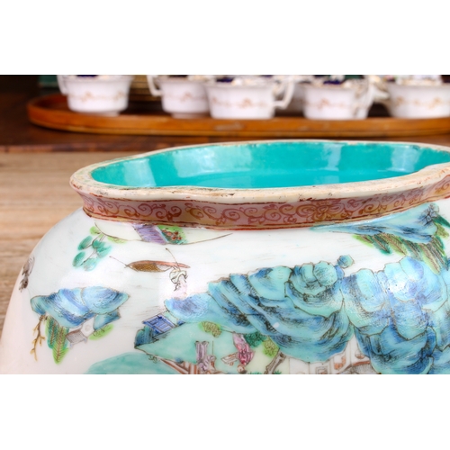 34 - A 20th century Chinese porcelain bowl of quatrefoil form: matt duck-egg blue glazed interior; the ex... 