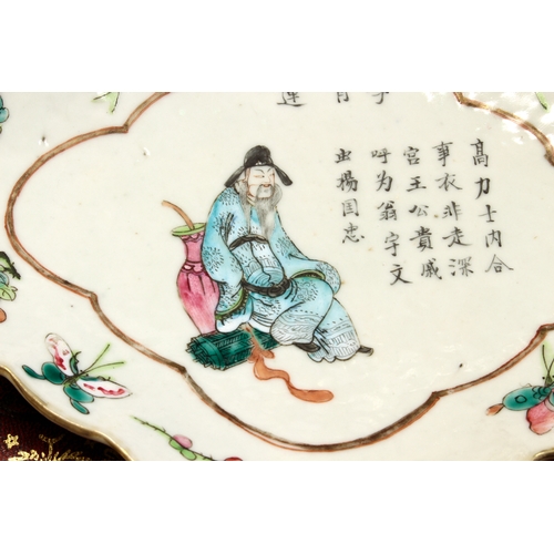 64 - A 19th century Chinese lozenge-shaped pedestal dish decorated in enamels: seated male figure dressed... 