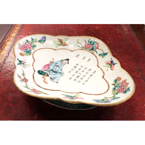 64 - A 19th century Chinese lozenge-shaped pedestal dish decorated in enamels: seated male figure dressed... 