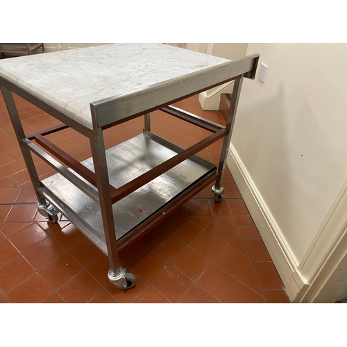 1 - 25mm thick Marble topped, freestanding, stainless steel trolley. On four caster wheels with two lowe... 