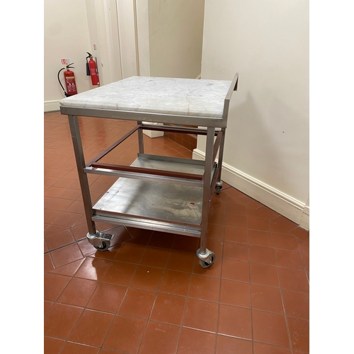 1 - 25mm thick Marble topped, freestanding, stainless steel trolley. On four caster wheels with two lowe... 