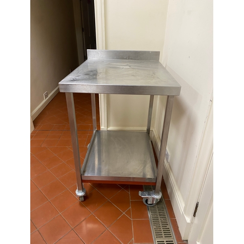 2 - Free-standing stainless-steel trolley. 4 caster wheels, with back upstand and a bottom tray. 
 76cm ... 