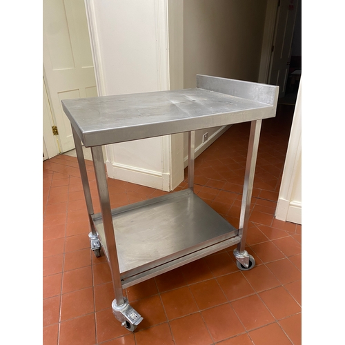 2 - Free-standing stainless-steel trolley. 4 caster wheels, with back upstand and a bottom tray. 
 76cm ... 