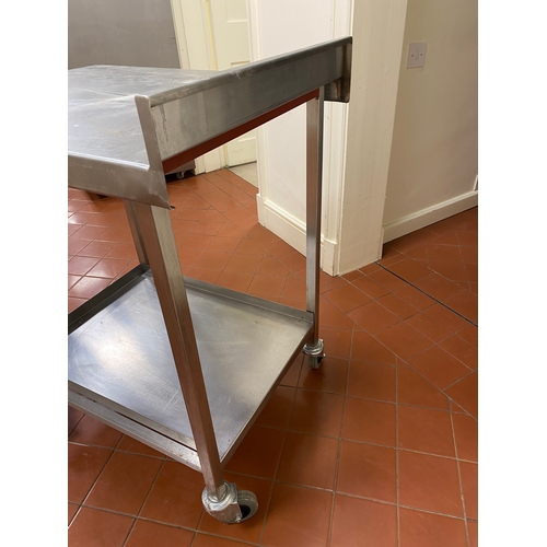 2 - Free-standing stainless-steel trolley. 4 caster wheels, with back upstand and a bottom tray. 
 76cm ... 