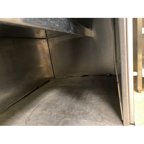 12 - Stainless steel worksurface with a lockable cabinet below. Cabinet has two sliding doors and one int... 