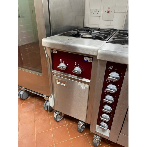 15 - Charvet to two ring gas cooker unit on four wheels. With a cupboard underneath.